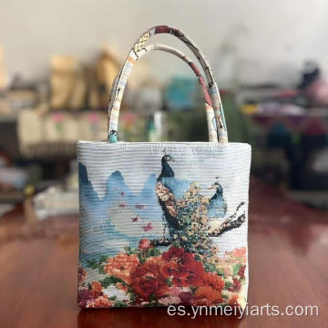 Bolso de mano teñido en hilo con tapiz tejido bohemio y estampado de pavo real